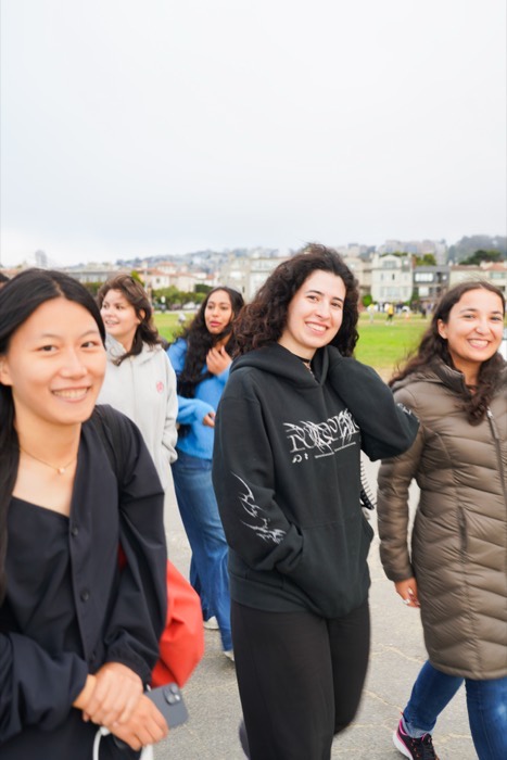 Women smiling mid-stride on a Cherry walk in San Francisco